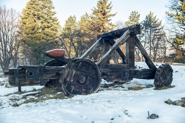 Old wooden catapult inside a fortress.