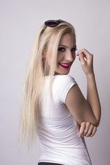 Fototapeta premium Attractive woman over a grey background