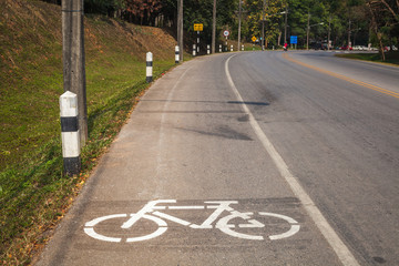 Obraz premium Cycle Lane with Cyclist in Mae Fah Luang University, Chiang-Rai Thailand