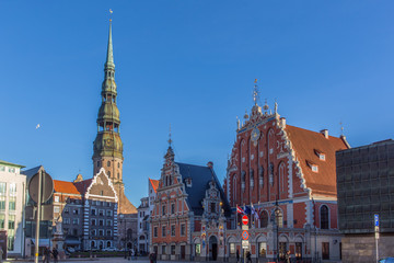 Fototapeta na wymiar Riga, Latvia - View of the Town Hall Square with House of the Blackheads and Saint Peter church (November 21, 2015)