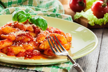 Italian gnocchi with tomato sauce and cheese