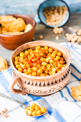 baked chickpeas with spices on rustic background, smoked paprika