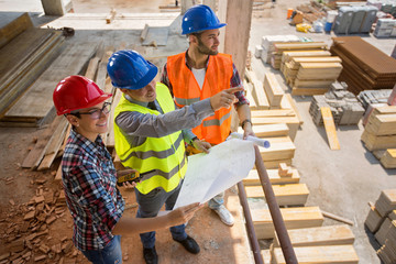 Site manager show planning details of future building