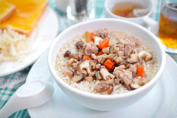 Boiled rice pork or mush for breakfast.