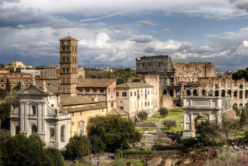 Fototapeta premium Roman Forum. The Temple of Venus and Roma, Church of Santa Francesca Romana, The Arch of Titus, The Colosseum. Rome, Italy.