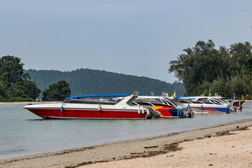 speed boats waiting for tourists in the Parking lot in Thailand