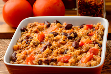 Mexican rice with black bean, corn, paprika and tomatoes.