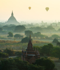 The ruin of ancient temple in the mist at Bagan City.