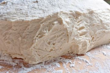 Raw dough on a kitchen table