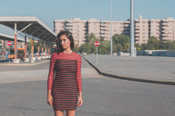 Beautiful girl posing in an urban context