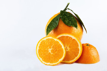 Orange fruits with leaves isolated over white background