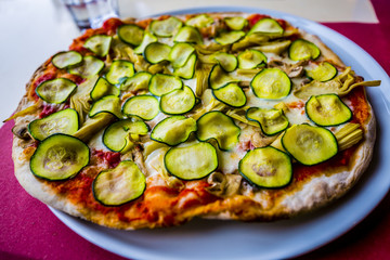 Pizza with vegetables and zucchini, Italian cuisine