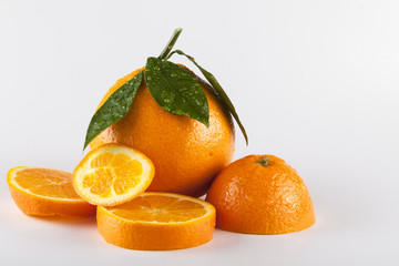 Orange fruits with leaves isolated over white background