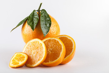 Orange fruits with leaves isolated over white background