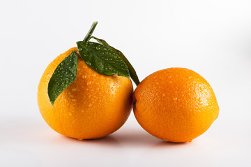 Orange fruits with leaves isolated over white background