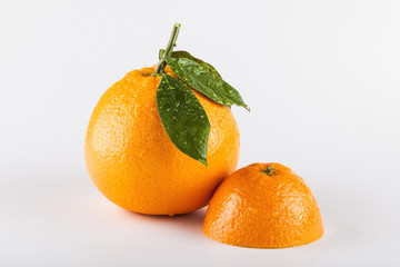 Orange fruits with leaves isolated over white background