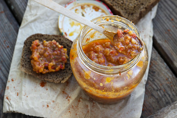 Traditional sauce adjika with bread, selective focus