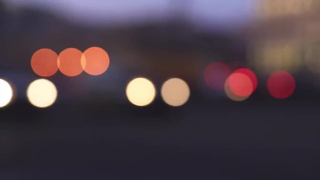 blurred background of traffic lights in the night city