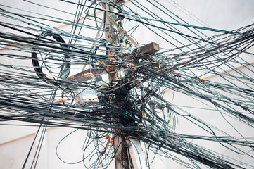 Electric poles filled with wires that looked messy.