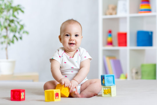 baby playing with building block toys