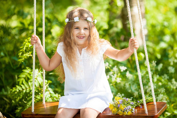 Cute little girl on the swing