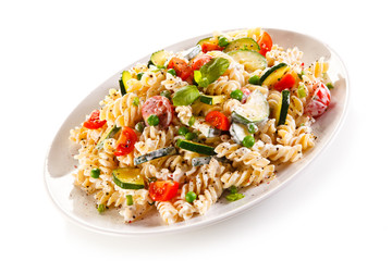 Fusilli pasta with white sauce and vegetables 