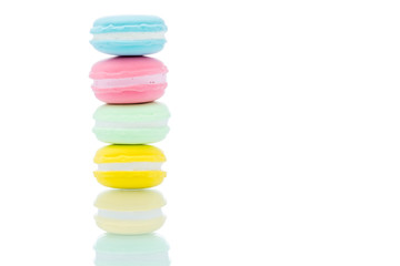 French colorful macarons stacks on white background