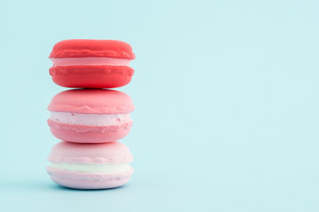 French colorful macarons stacks on pastel background, retro Styl