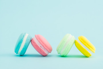 French colorful macarons on pastel background, retro Styled