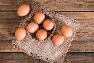 chicken eggs on wooden background