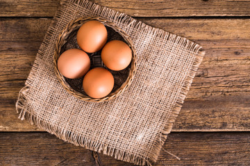 chicken eggs on wooden background