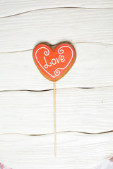 the original baking - gingerbread hearts on white wood background
