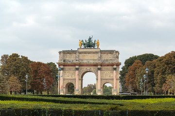 Fototapeta na wymiar Paris - Triumphal Arch at Tuileries. Tuileries Garden - public garden located between Louvre and Concorde Place. It was opened in 1667. Paris, France