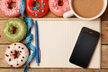 Colorful donuts and notepad