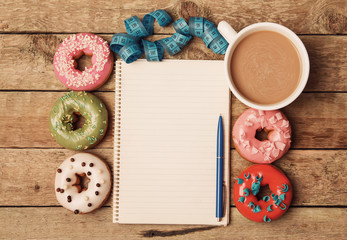 Colorful donuts and notepad