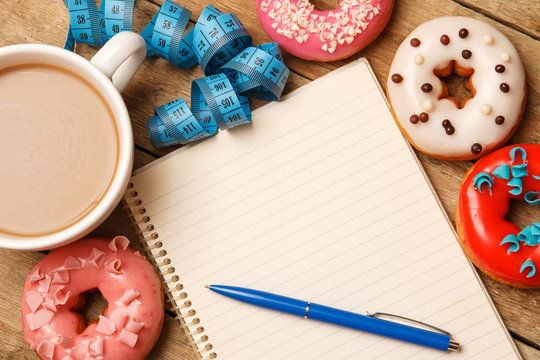 Colorful donuts and notepad