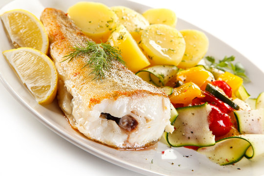 Fish dish - fried fish fillet and vegetables 