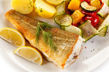 Fish dish - fried fish fillet and vegetables 
