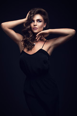 Fototapeta premium Beautiful woman in black dress