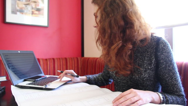 Young woman working with sketch