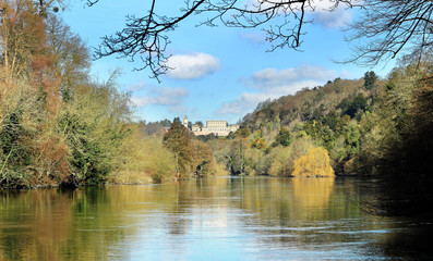 The River Thames in Winter with a Stately Home amidst the trees