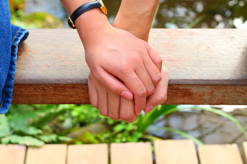 The close up shot of couple hand holding together concept of love, care, encourage and relationship
