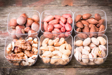 Mix nuts on wooden table,healthy vegan food.