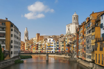 Fototapeta na wymiar The old quarter of Girona with Onyar river, Eiffel bridge and t