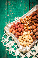 Mix nuts on wooden table,healthy vegan food.