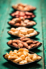 Mix nuts on wooden table,healthy vegan food.