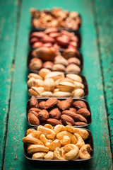 Mix nuts on wooden table,healthy vegan food.