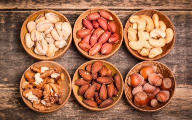 Mix nuts on wooden table,healthy vegan food.