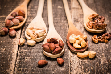 Mix nuts on wooden table,healthy vegan food.