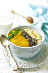 Oat porridge with chia seed,canned peaches and honey.